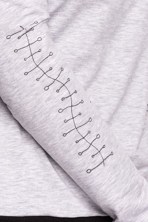 Women's grey long-sleeved sports sweater with grey embroidery on the forearms